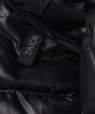 Close-up name tag detail of Taion Hi Neck W-Zip Down Jacket in Navy – premium branding finish