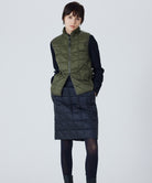 Model wearing Taion Hi Neck W-Zip Down Vest in D.Olive