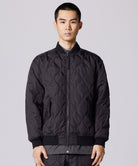 Model wearing Taion Military MA-1 Type Down Jacket in Black with insulated bomber-style fit and everyday comfort