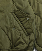 Functional pocket detail of Taion Military MA-1 Type Down Jacket in Olive with secure storage design