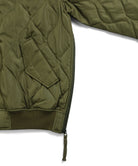 Side slit zipper detail of Taion Military MA-1 Type Down Jacket in Olive for improved mobility and comfort