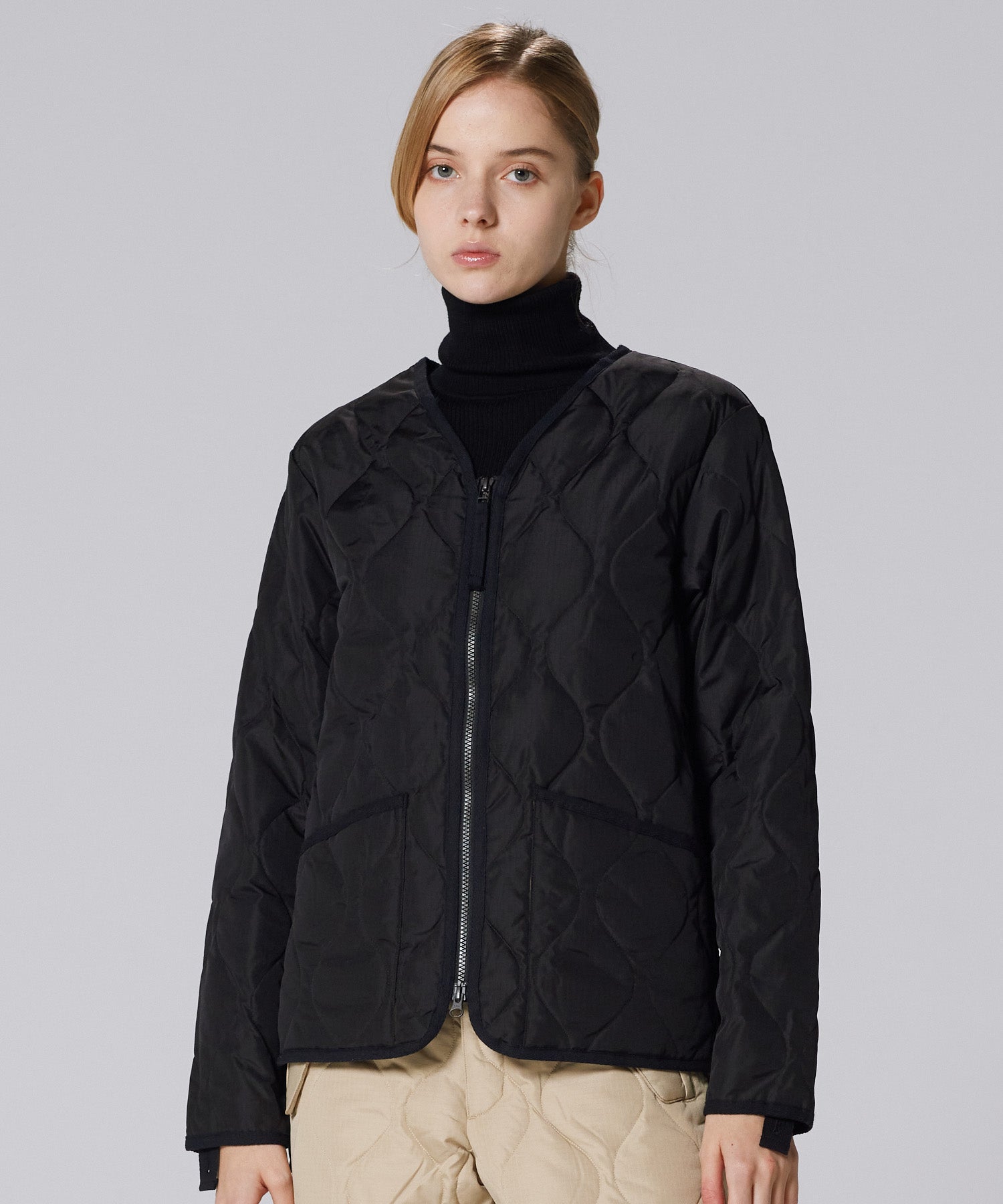 Model wearing Taion Military Zip V Neck Down Jacket in Black