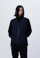 Side view of Taion Military Zip V Neck Down Vest in D.Navy