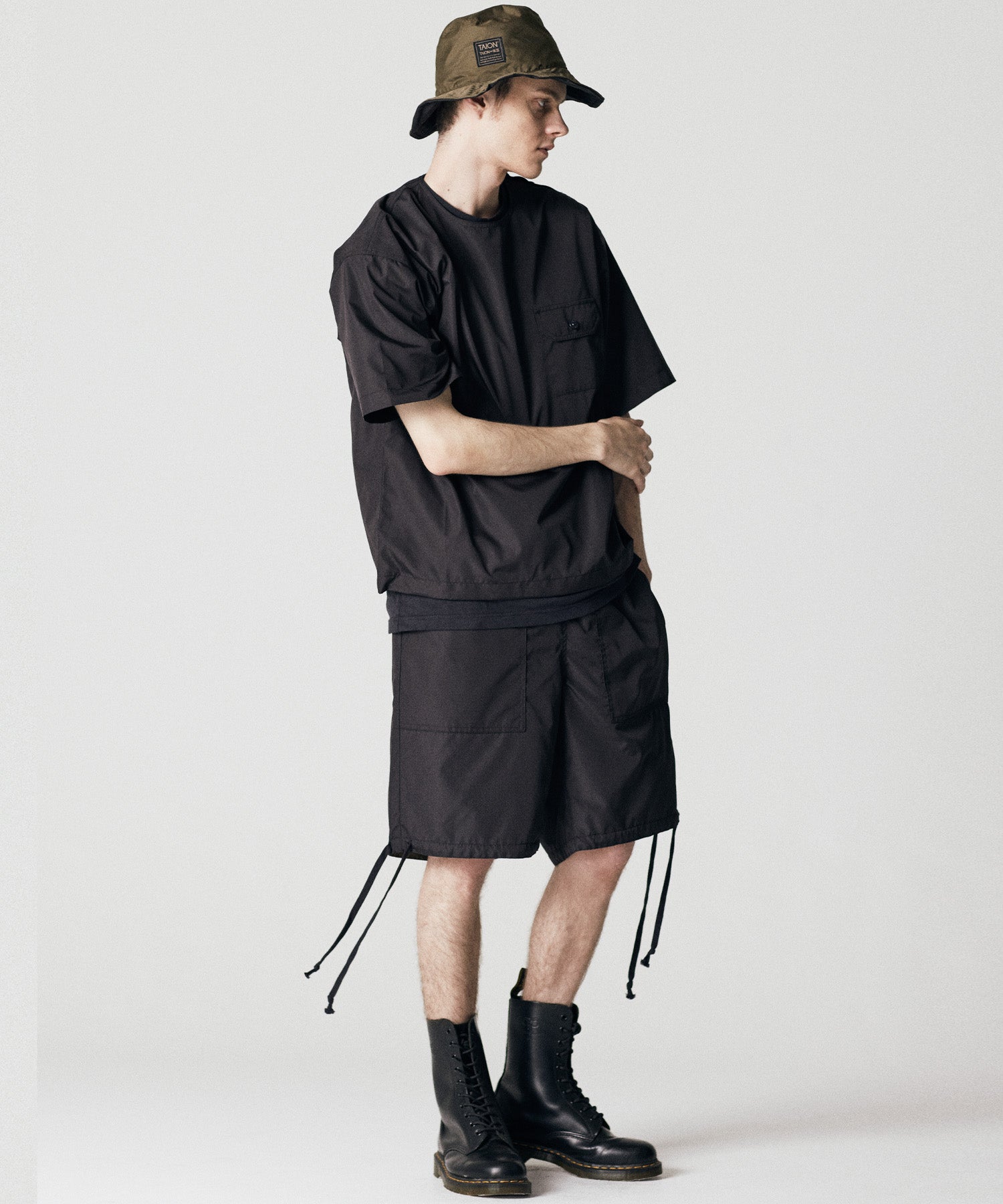 Taion Non Down Military Half Sleeve Cut Sew in Black with lightweight stain-resistant fabric and relaxed everyday comfort
