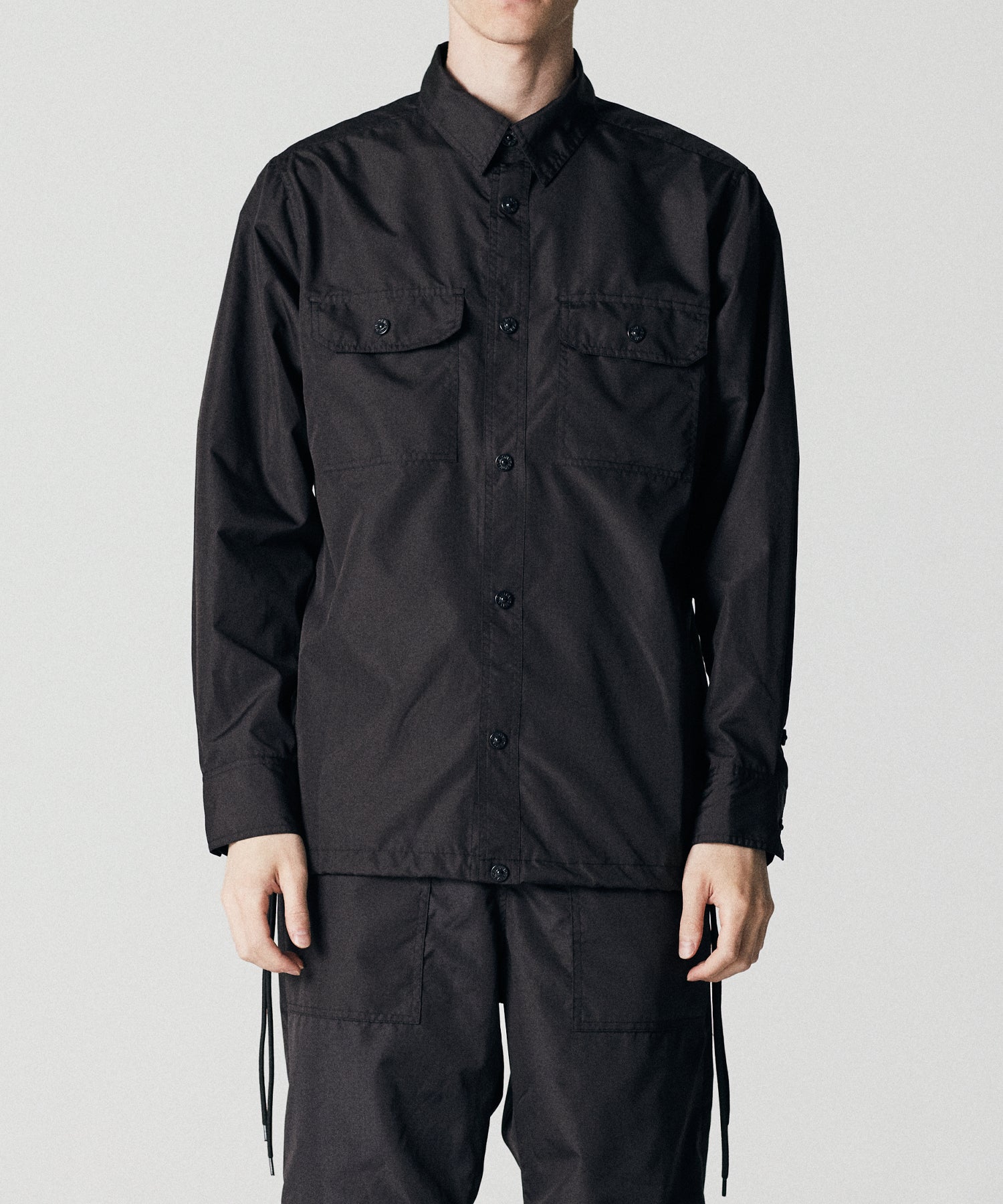 Taion Non Down Military Long Sleeve Shirt in Black – lightweight utility fabric with adjustable fit and everyday comfort