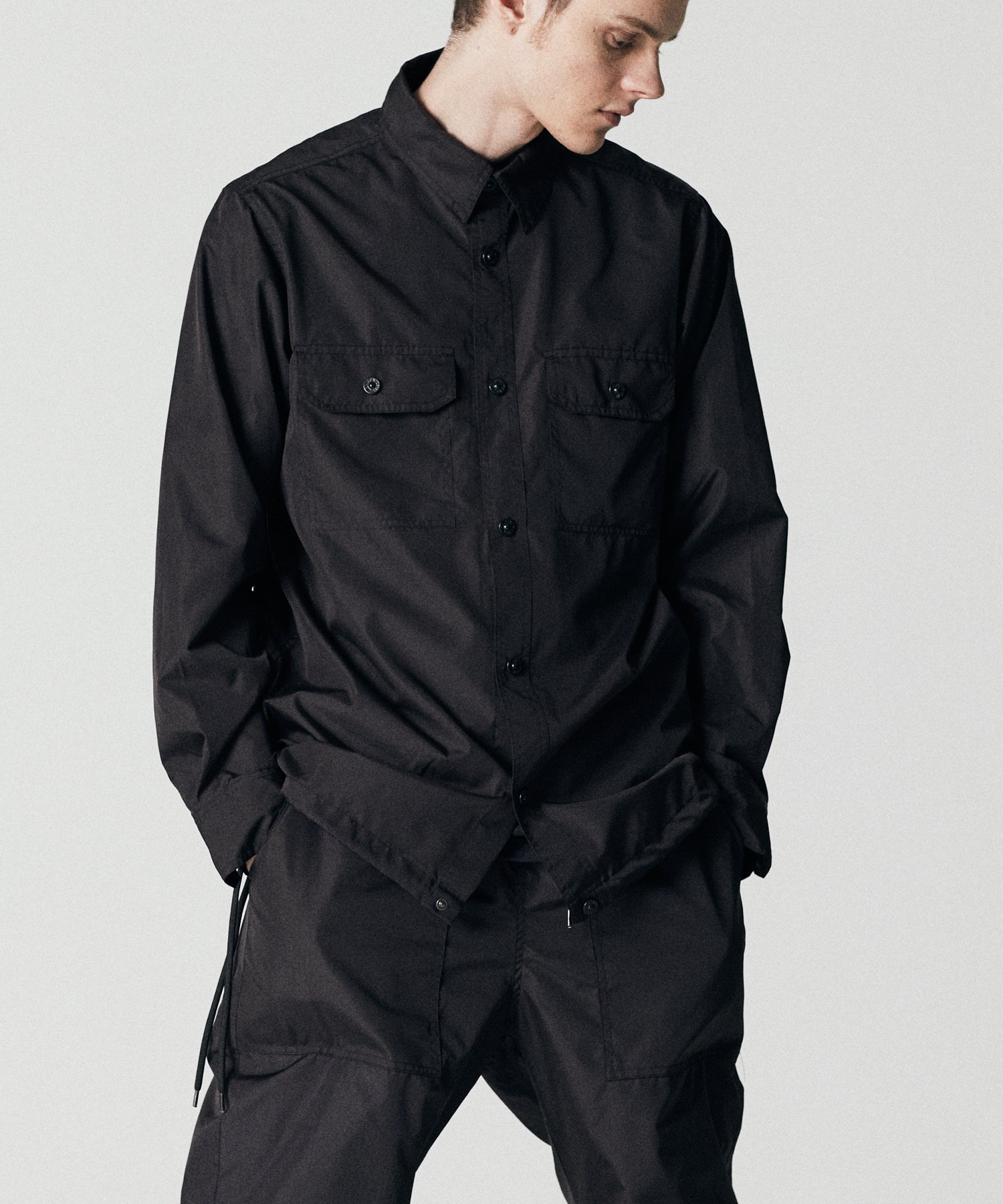 Taion Non Down Military Long Sleeve Shirt in Black – lightweight utility fabric with adjustable side fit and everyday comfort