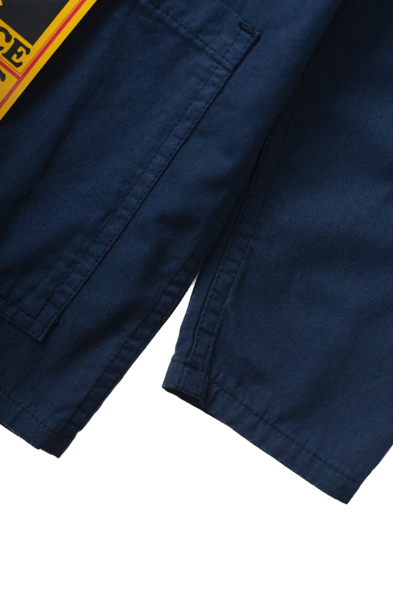 Dark navy twill chore shirt lifestyle view premium workwear utility shirt modern streetwear outfit