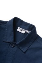 Dark navy twill chore shirt worn lifestyle view premium workwear utility shirt relaxed streetwear fit