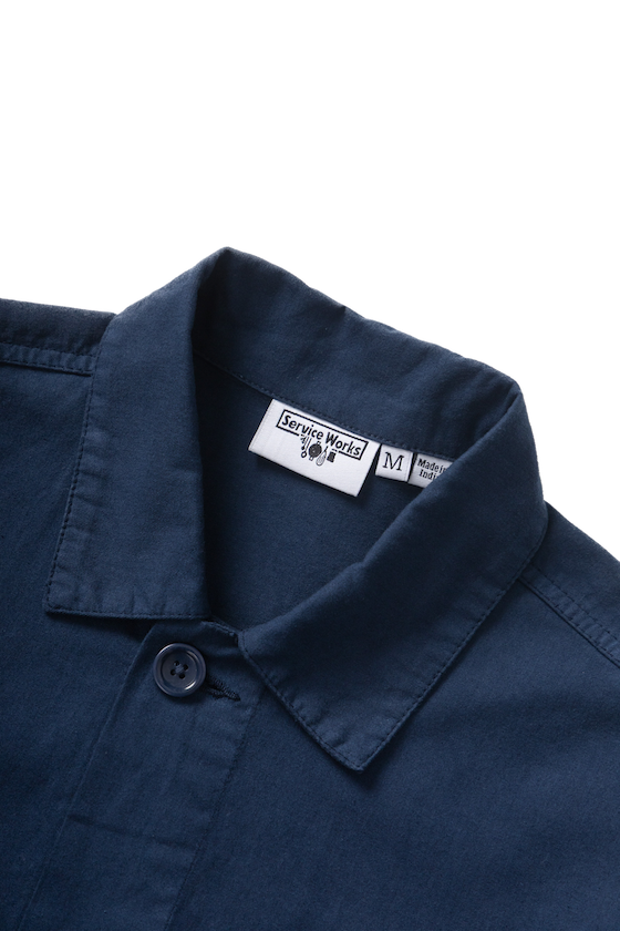 Dark navy twill chore shirt worn lifestyle view premium workwear utility shirt relaxed streetwear fit
